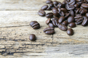 Coffee beans on wood background
