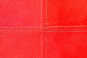 Red leather seamless closeup texture.