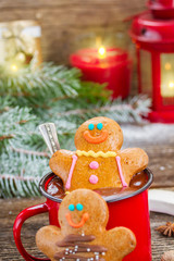 Gingerbread men with mug of hot chocolate