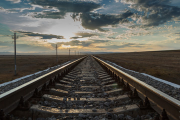 Fototapeta na wymiar Railway rails of stretching into the distance