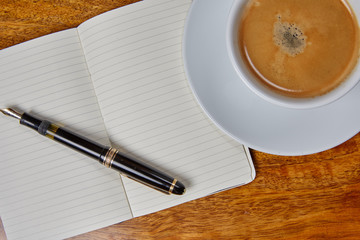 Notepad and coffee