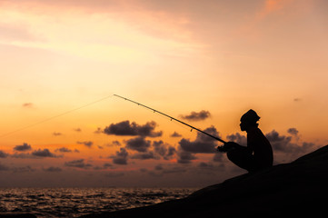 Fisherman on sunset
