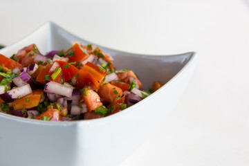 pico de gallo in a white bowl 