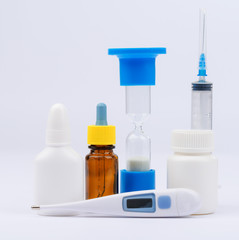 Thermometer with bottles of medicine and syringe injection