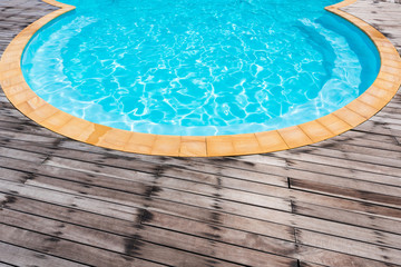 Beautiful Circular pool with wooden plank
