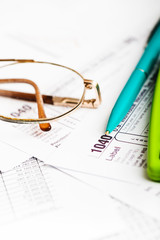 Tax form, pen and calculator