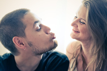 Young man and woman together over white background