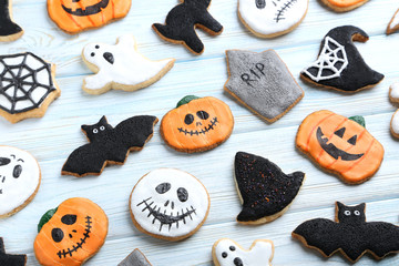 Fresh halloween gingerbread cookies on blue wooden table