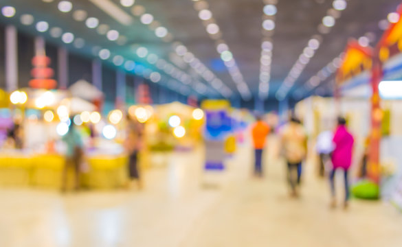 blurred image of people at trade show