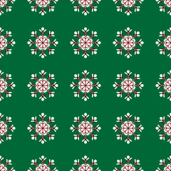 snowflakes on green background Christmas seamless pattern