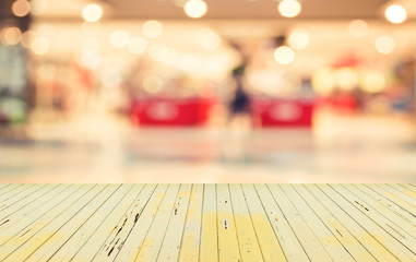 blurred image of modern shopping mall and people .