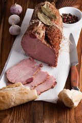 Smoked ham on a chopping board.