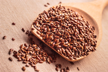 Flax seeds linseed on wooden spoon