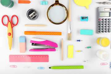 Bright stationery objects on table close up