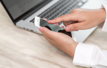 Woman hand hold smart phone with blank empty screen
