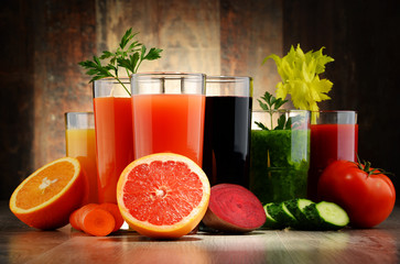 Glasses with fresh organic vegetable and fruit juices