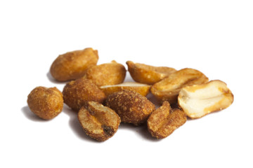 Roasted peanuts isolated on white.