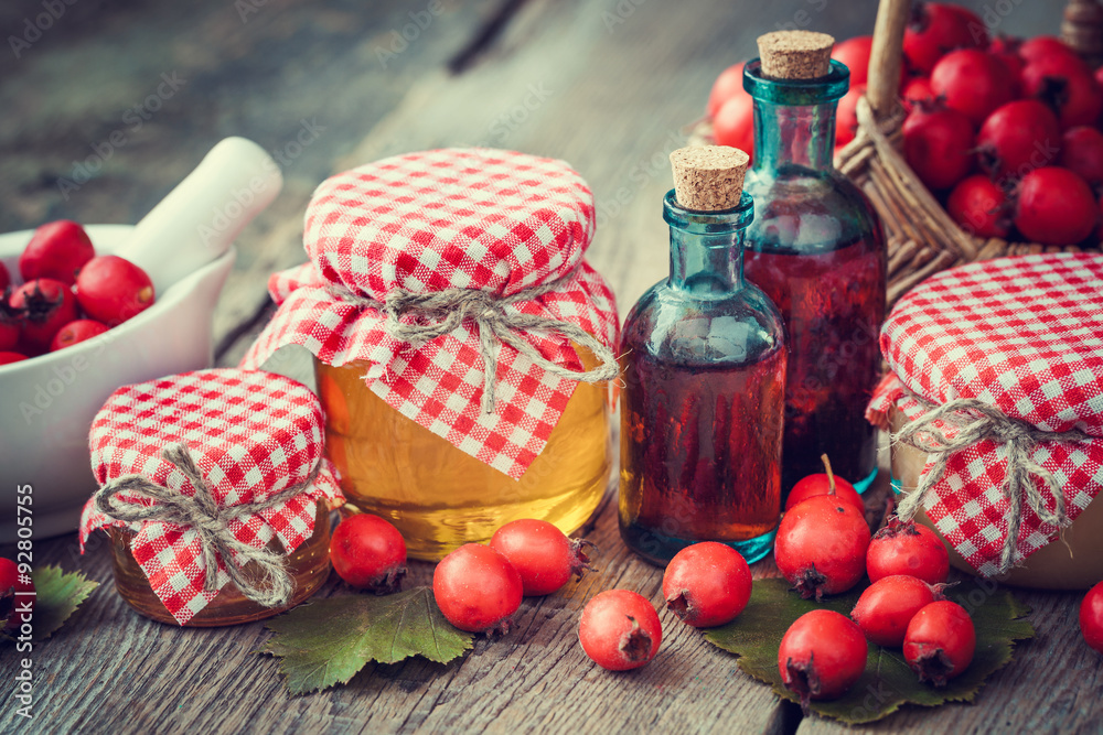 Wall mural jars of honey, tincture bottles and mortar of hawthorn berries o