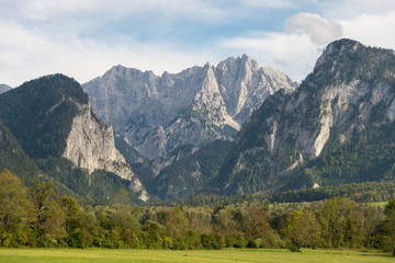 Fototapeta na wymiar Water gap from the Gesäuse mountain range and view into the Enns valley and the Hochtor massif. The Gesäuse range is part of the Ennstal Alps and a national park in Styria, Austria 