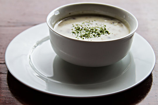 White plate of delicious traditional mushroom cream soup.Tasty