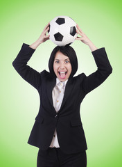 Businesswoman with ball on white