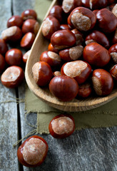 chestnuts on wooden surface