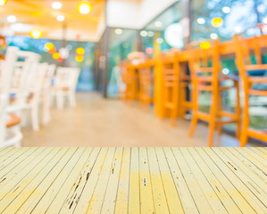 Coffee shop blur background with bokeh image .