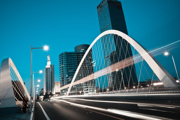 Arc bridge girder highway car light trails city night landscape