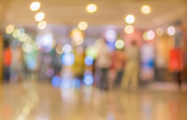 blur image of Long empty corridor on night time with bokeh.