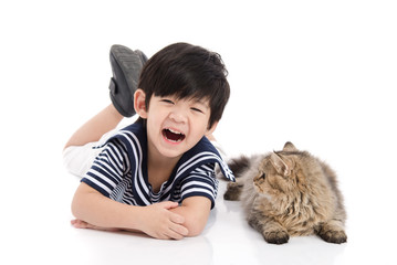 Cute asian child lying with tabby cat