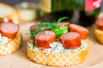 Tapas appetizer with sauce and sausage