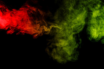 Abstract red and green smoke hookah on a black background.