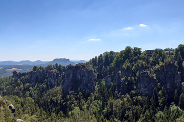 Panorama with rocks Bastei, table mountain Lilienstein and hotel in Rathen, Saxon Switzerland