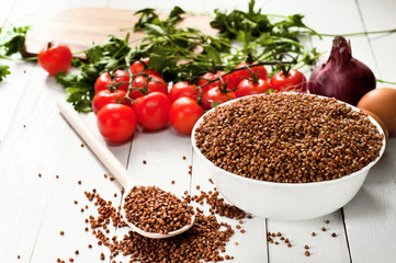 Buckwheat in the white deep ceramic plate