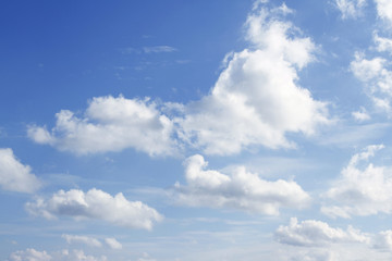 Naklejka na ściany i meble Soft white clouds in blue sky