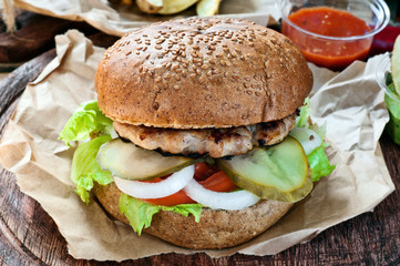 Fresh burger with sauce on paper