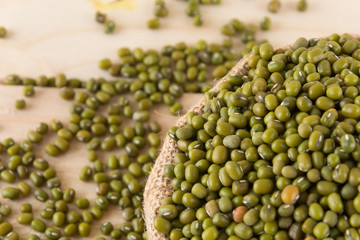 green beans on wood background