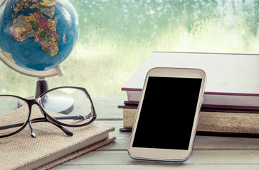 Cellphone,smart phone,phone with book,globe and eyeglasses