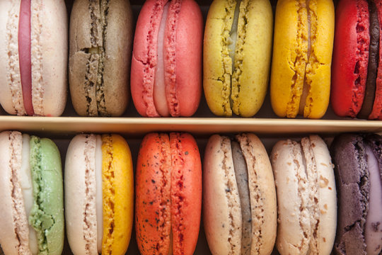 Stack of colorful macaroons stacked up in the box for background