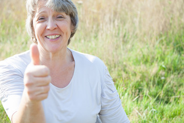 Old age woman showing thumbs up