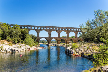 The picturesque landscape with aqueduct Pont du Gard, France. Aqueduct is included in the UNESCO World Heritage List