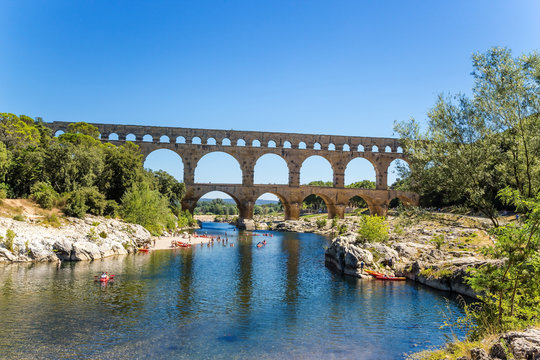 The picturesque landscape with aqueduct Pont du Gard, France. Aqueduct is included in the UNESCO World Heritage List