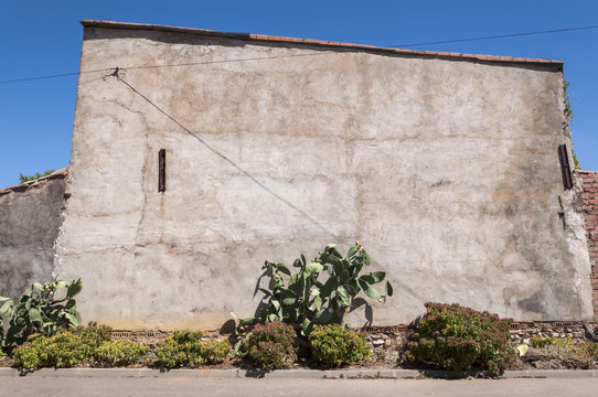 Concrete wall in a small hamlet in La Mancha, Ciudad Real Province, Spain