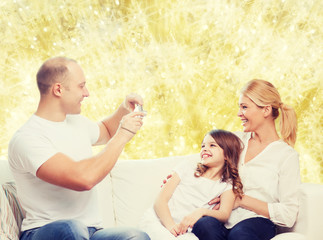 happy family with camera at home