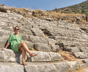 Fototapeta premium beautiful woman on the ruins of the Colosseum. Turkey, Kemer.