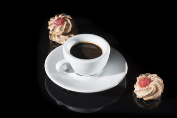 Wake up. Small white cup of Italian espresso with biscuit