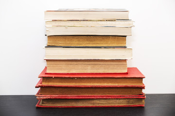 Pile of old vintage books on a shelf