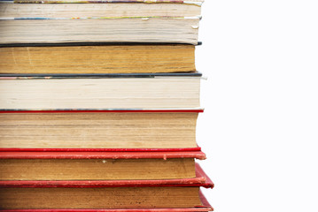 Pile of old vintage books isolated on white background