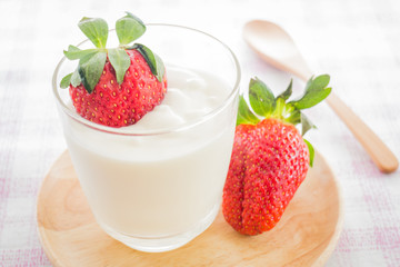 Glass of yogurt with fresh strawberry