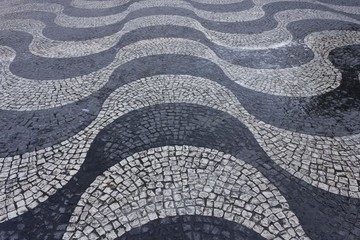 Wave cobblestone artistic pavement in Rossio Square in Lisbon, close up
